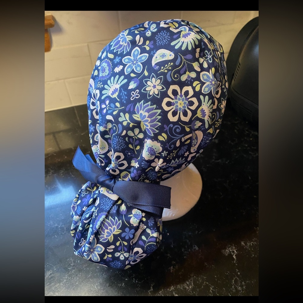 Floral scrub cap with buttons. Ponytail tie back. Handmade. Like new!
